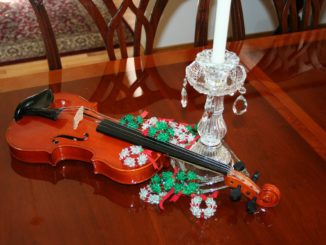 Violin with a candle
